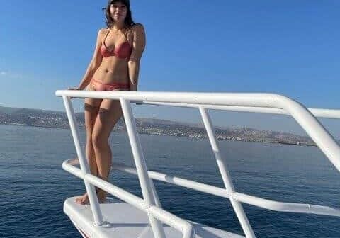 girl stand on boat bow