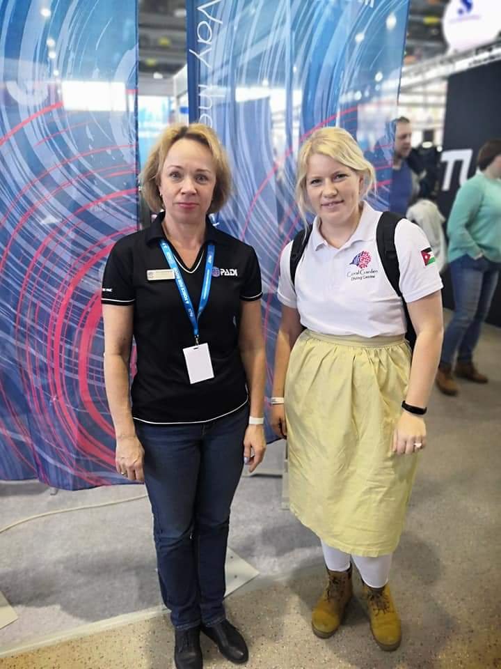 female instructor with other female in dive show